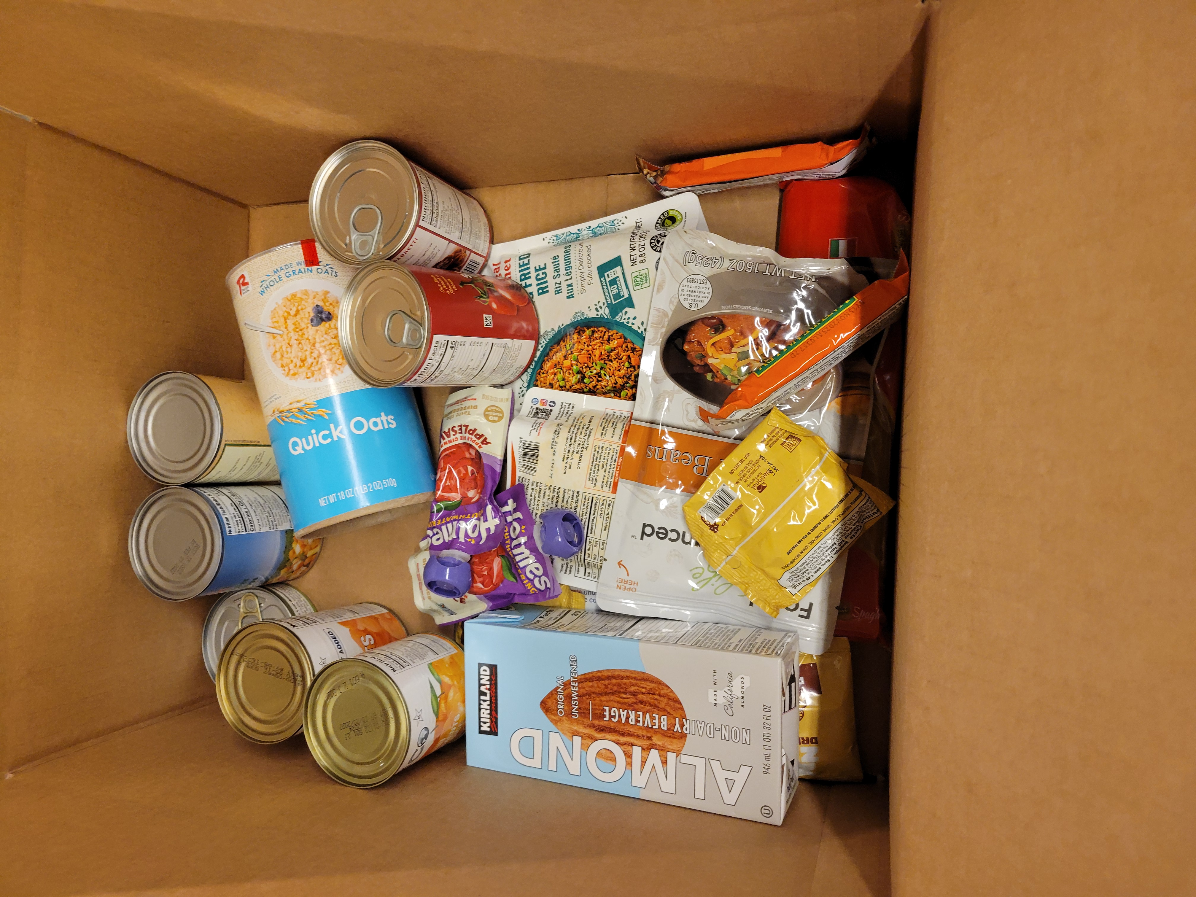 Cardboard box full of dry goods.